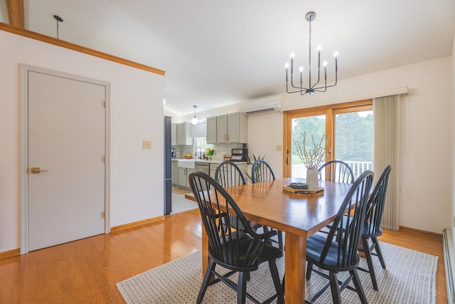 1684 W W County Line Rd, Sand Lake, MI 49343 - dining area featuring light wood-style floors, a chandelier, a wall mounted air conditioner, and a baseboard heating unit
