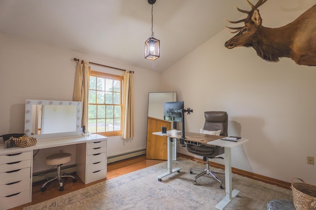 1684 W W County Line Rd, Sand Lake, MI 49343 - home office with baseboard heating, lofted ceiling, and wood finished floors