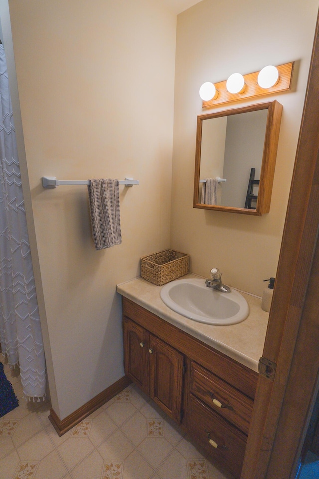 1684 W W County Line Rd, Sand Lake, MI 49343 - bathroom featuring vanity and baseboards