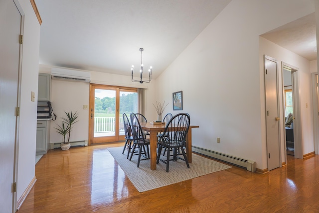 1684 W W County Line Rd, Sand Lake, MI 49343 - dining area with a wall mounted air conditioner, baseboard heating, a chandelier, wood finished floors, and vaulted ceiling