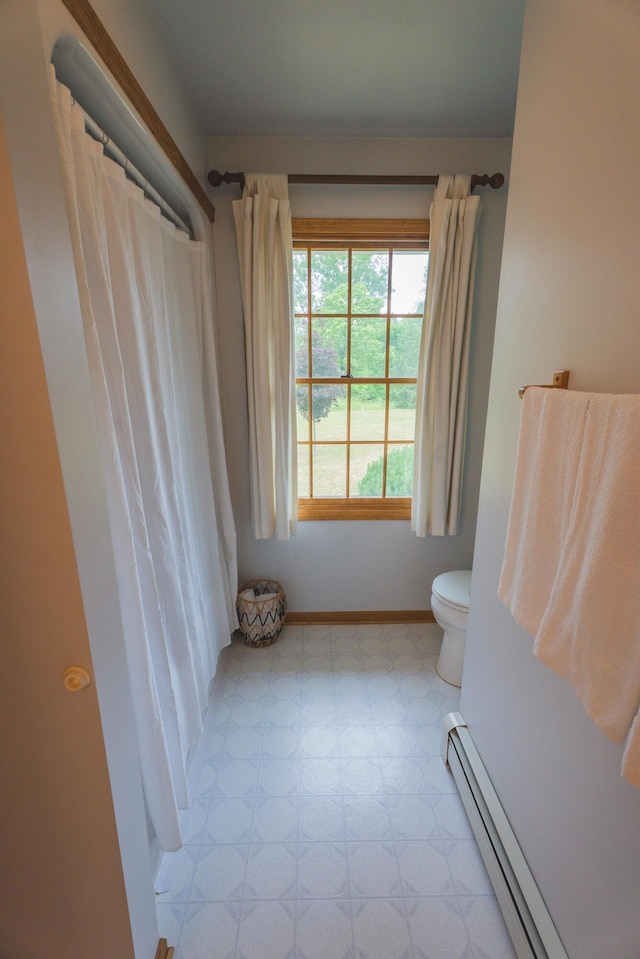 1684 W W County Line Rd, Sand Lake, MI 49343 - full bathroom with a baseboard radiator, tile patterned floors, and curtained shower
