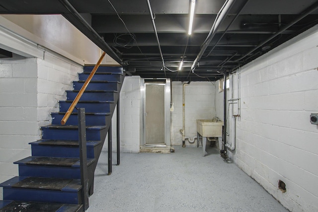 185 W 21st St, Holland, MI 49423 - unfinished basement with stairway and concrete block wall