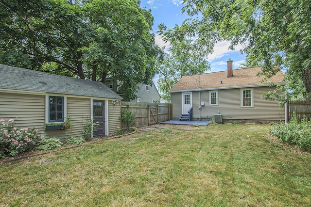 185 W 21st St, Holland, MI 49423 - back of property with a chimney and a patio area