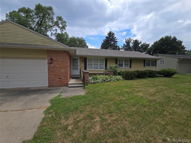 22024 Lester St, Clinton Township, MI 48035 - ranch-style house with a front yard, brick siding, asphalt driveway, and a garage