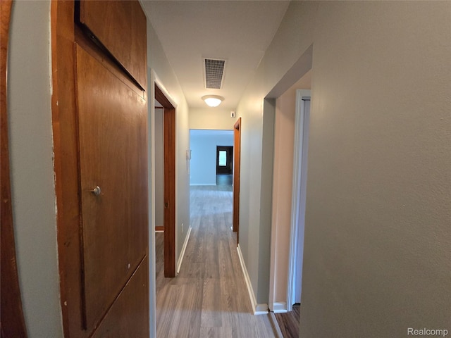 22024 Lester St, Clinton Township, MI 48035 - hallway featuring wood finished floors and baseboards