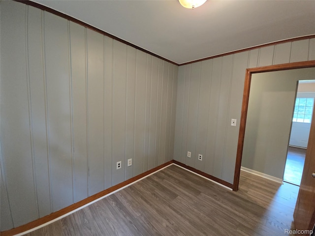 22024 Lester St, Clinton Township, MI 48035 - spare room with dark wood-type flooring and crown molding