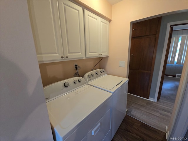 22024 Lester St, Clinton Township, MI 48035 - laundry room with independent washer and dryer, cabinet space, and dark wood-style flooring