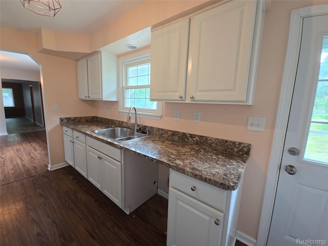 22024 Lester St, Clinton Township, MI 48035 - kitchen with dark wood-style flooring, dark countertops, and white cabinets