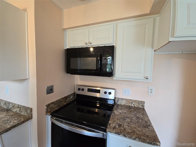 22024 Lester St, Clinton Township, MI 48035 - kitchen with black microwave, electric stove, white cabinetry, and dark stone countertops