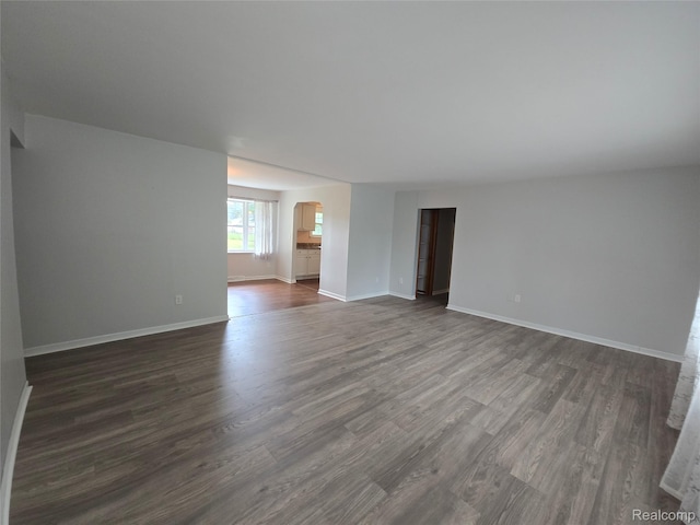 22024 Lester St, Clinton Township, MI 48035 - unfurnished room with dark wood finished floors and baseboards