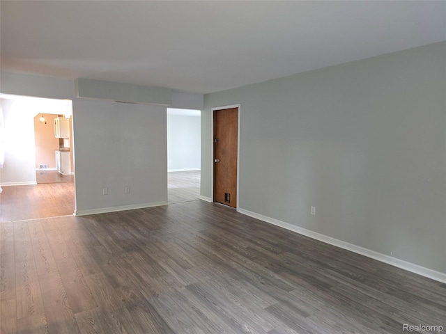 22024 Lester St, Clinton Township, MI 48035 - unfurnished room featuring dark wood finished floors and baseboards