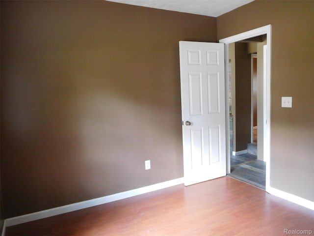 3351 Grant Rd, Rochester Hills, MI 48309 - spare room with wood finished floors and baseboards