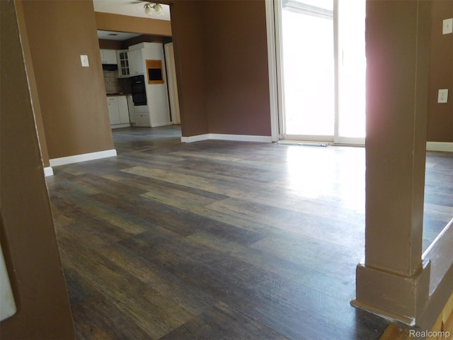 3351 Grant Rd, Rochester Hills, MI 48309 - unfurnished living room featuring baseboards and dark wood-style floors