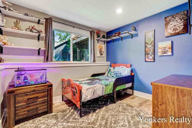 4005 Bullseye Ln, Dorr, MI 49323 - bedroom featuring wood finished floors and recessed lighting