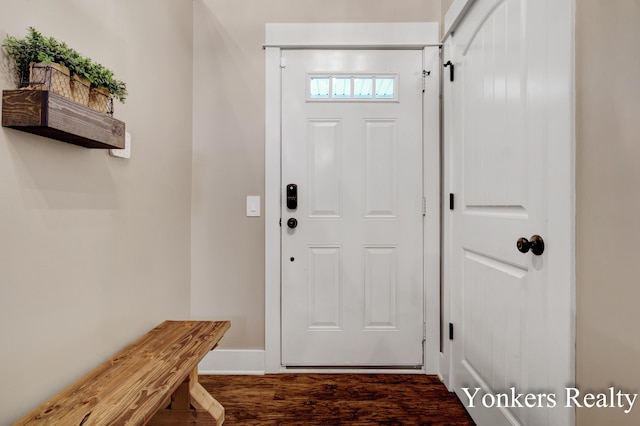 4005 Bullseye Ln, Dorr, MI 49323 - entrance foyer featuring dark wood-type flooring and baseboards