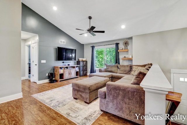 4005 Bullseye Ln, Dorr, MI 49323 - living area with a ceiling fan, wood finished floors, vaulted ceiling, and recessed lighting