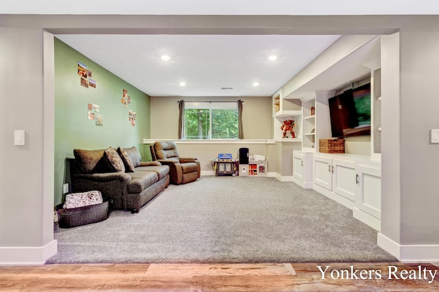 4005 Bullseye Ln, Dorr, MI 49323 - carpeted living room featuring baseboards and recessed lighting