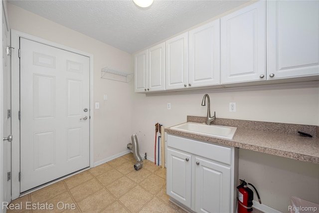 480 Hosta, Howell, MI 48843 - laundry area with a textured ceiling and light flooring