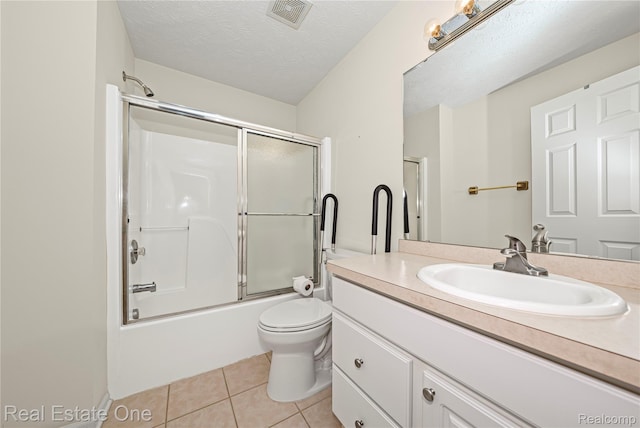 480 Hosta, Howell, MI 48843 - full bathroom with vanity, tile patterned floors, combined bath / shower with glass door, and a textured ceiling