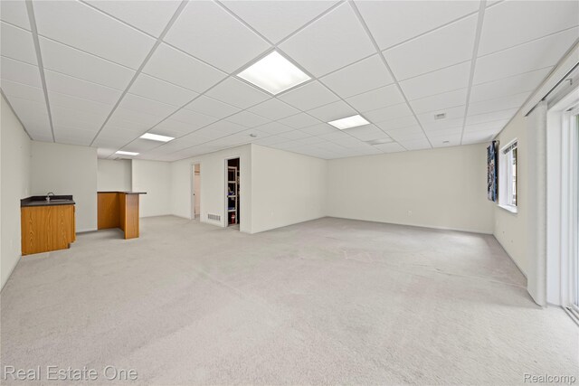 480 Hosta, Howell, MI 48843 - below grade area with light colored carpet and a paneled ceiling