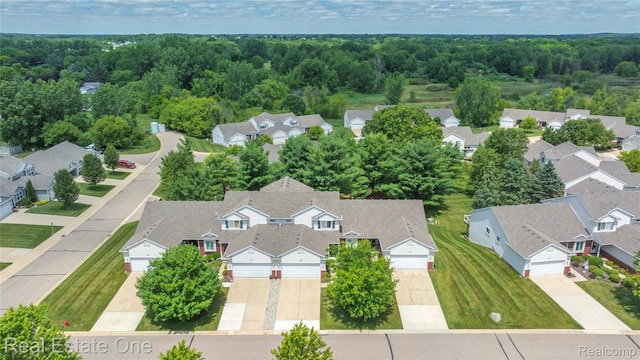 480 Hosta, Howell, MI 48843 - aerial perspective of suburban area with a forest