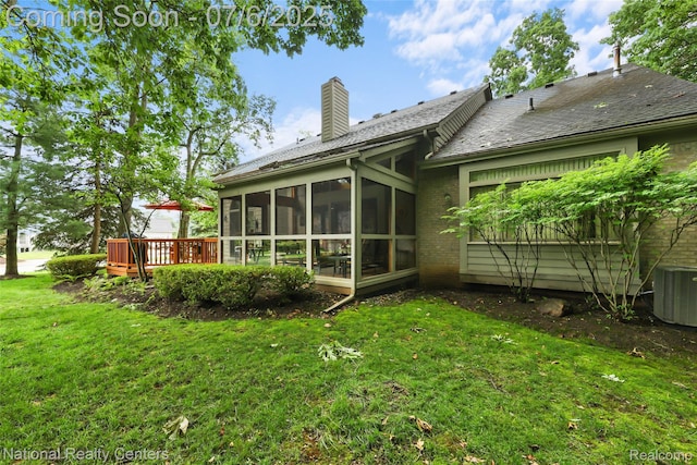 7319 Autumn Hill Dr, West Bloomfield, MI 48323 - rear view of property featuring a yard, a sunroom, a chimney, and brick siding