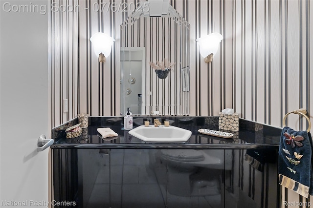 7319 Autumn Hill Dr, West Bloomfield, MI 48323 - bathroom featuring wallpapered walls and vanity