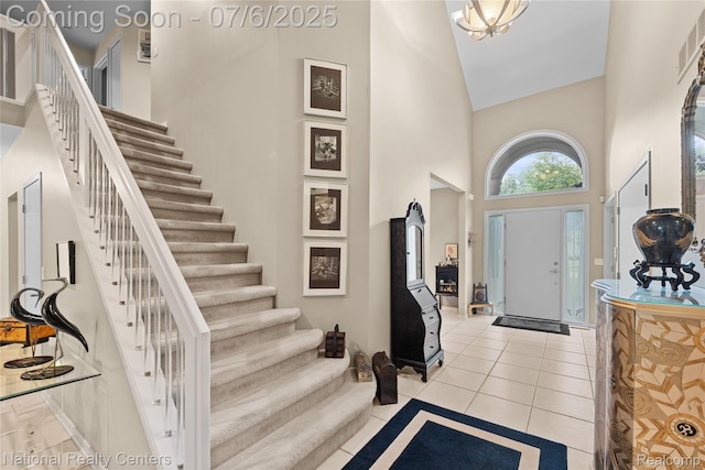 7319 Autumn Hill Dr, West Bloomfield, MI 48323 - entryway featuring a high ceiling, stairs, and light tile patterned floors