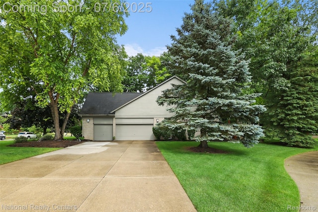 7319 Autumn Hill Dr, West Bloomfield, MI 48323 - view of property hidden behind natural elements with a garage, driveway, a front yard, and roof with shingles