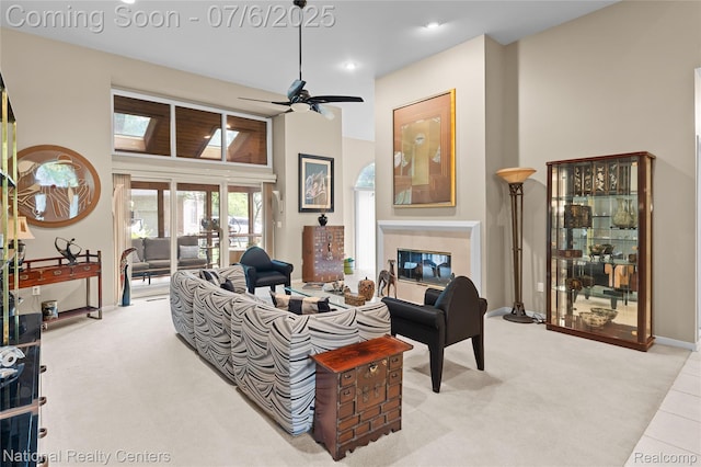7319 Autumn Hill Dr, West Bloomfield, MI 48323 - living area with carpet floors, a tile fireplace, ceiling fan, recessed lighting, and a high ceiling