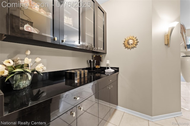 7319 Autumn Hill Dr, West Bloomfield, MI 48323 - bar area featuring light tile patterned floors and baseboards