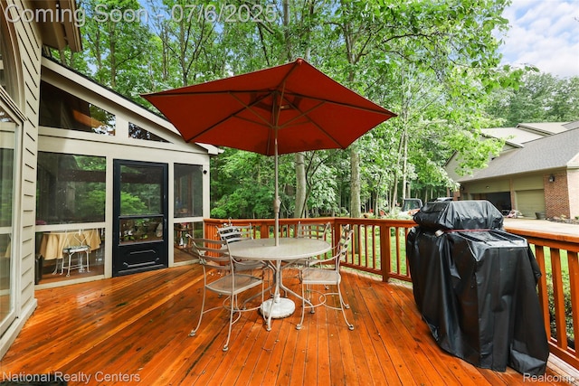 7319 Autumn Hill Dr, West Bloomfield, MI 48323 - wooden terrace with outdoor dining space, a sunroom, area for grilling, and view of wooded area