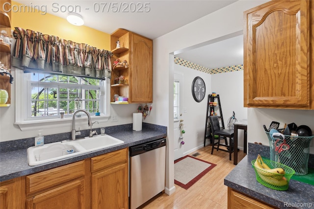 2187 Anoka St, Flint, MI 48532 - kitchen with stainless steel dishwasher, open shelves, light wood-style floors, dark countertops, and brown cabinetry