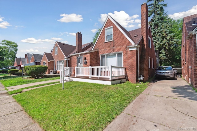 9585 Asbury Park, Detroit, MI 48227 - view of front of property featuring brick siding, a front yard, and a chimney