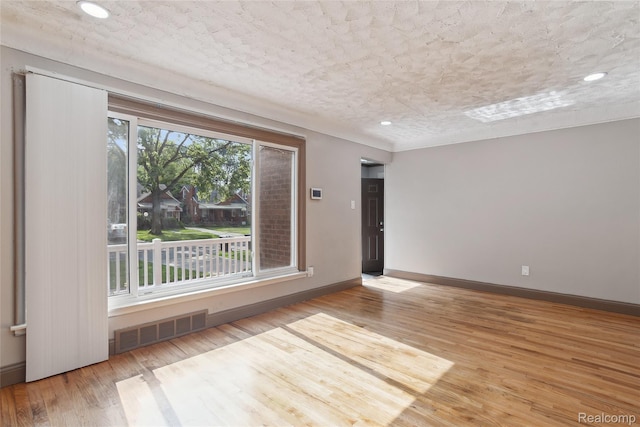 9585 Asbury Park, Detroit, MI 48227 - spare room featuring wood finished floors, recessed lighting, and a textured ceiling
