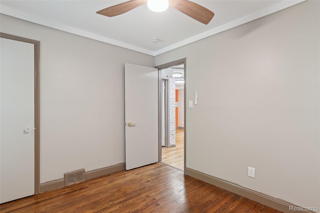 9585 Asbury Park, Detroit, MI 48227 - unfurnished bedroom with wood finished floors and ceiling fan
