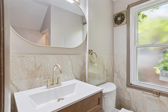 9585 Asbury Park, Detroit, MI 48227 - bathroom with tile walls, vanity, plenty of natural light, and wainscoting