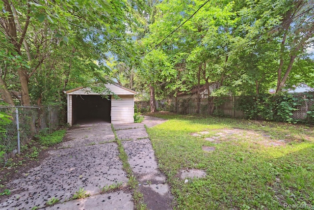 9585 Asbury Park, Detroit, MI 48227 - fenced backyard with an outdoor structure and driveway