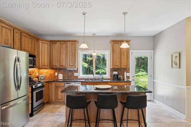7155 Campbell Mills Ct, Brighton, MI 48116 - kitchen with stainless steel appliances, backsplash, and healthy amount of natural light