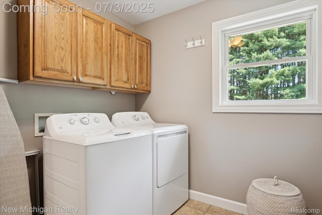 7155 Campbell Mills Ct, Brighton, MI 48116 - washroom with cabinet space, washing machine and dryer, and light tile patterned flooring
