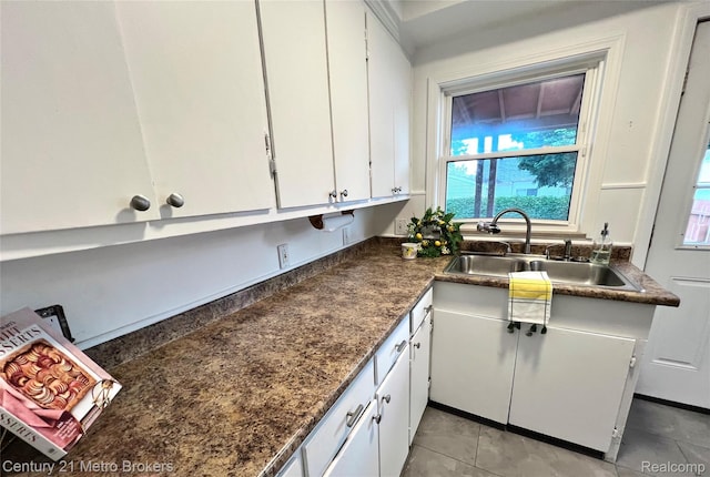 2122 Pierce St, Flint, MI 48503 - kitchen featuring white cabinets and dark countertops