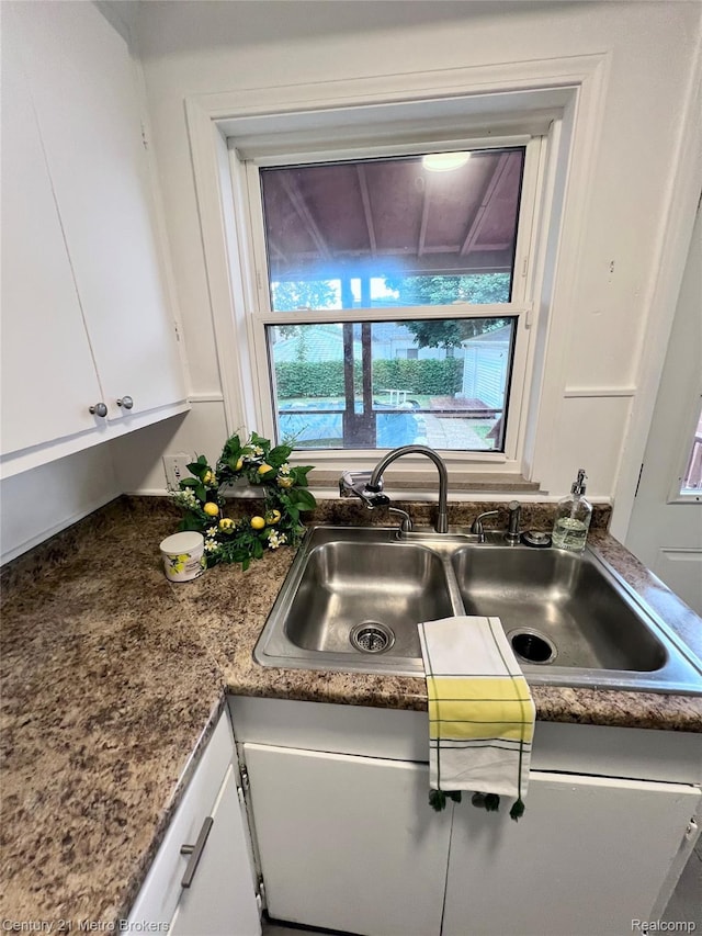 2122 Pierce St, Flint, MI 48503 - kitchen view of a sink and white cabinets