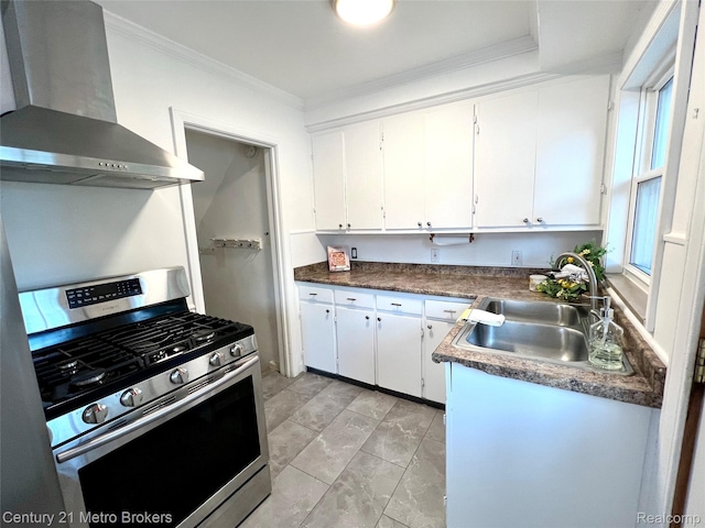 2122 Pierce St, Flint, MI 48503 - kitchen with wall chimney range hood, stainless steel range with gas stovetop, ornamental molding, white cabinets, and dark countertops