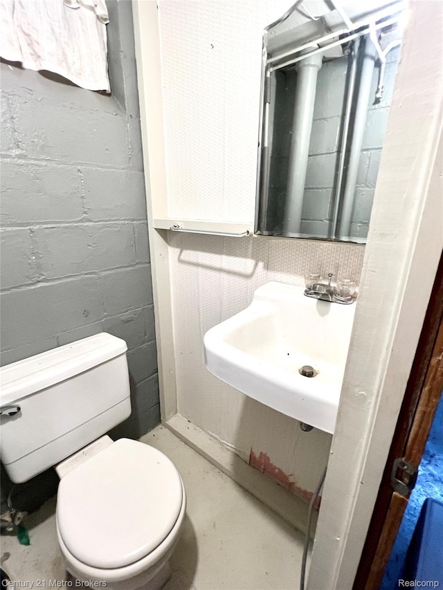 2122 Pierce St, Flint, MI 48503 - bathroom featuring toilet and concrete floors