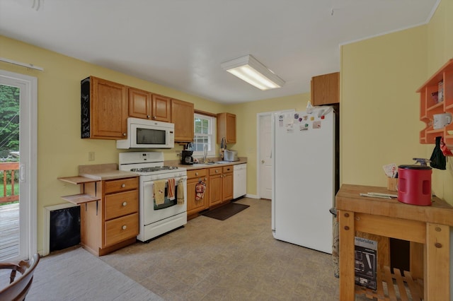 70661 Dennis Dr, Niles, MI 49120 - kitchen featuring white appliances, light countertops, and brown cabinetry