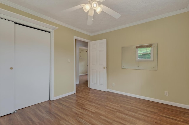 70661 Dennis Dr, Niles, MI 49120 - unfurnished bedroom featuring light wood-type flooring, ornamental molding, a closet, and ceiling fan