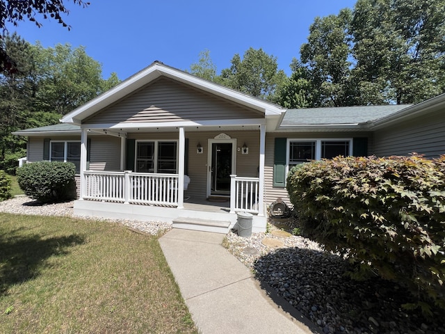 260 Treml, Michigan, MI 49411 - view of front facade featuring covered porch
