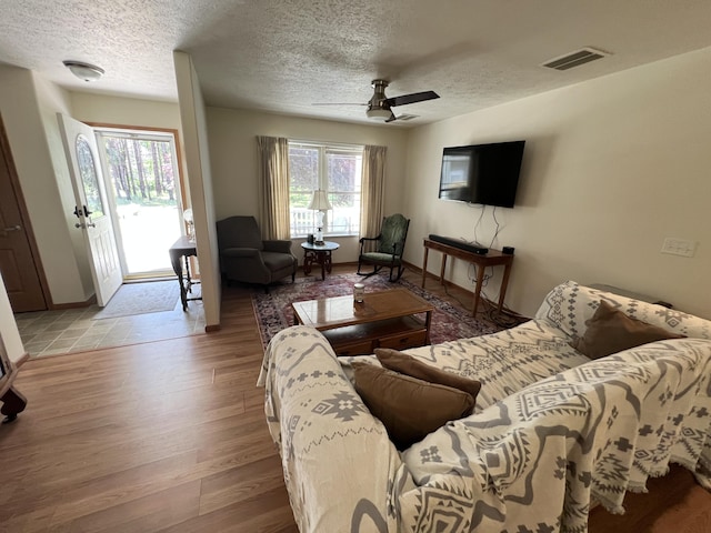 260 Treml, Michigan, MI 49411 - living area with a textured ceiling, wood finished floors, and a ceiling fan
