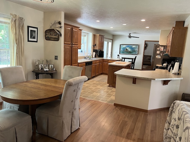 260 Treml, Michigan, MI 49411 - kitchen featuring a peninsula, appliances with stainless steel finishes, light countertops, recessed lighting, and healthy amount of natural light