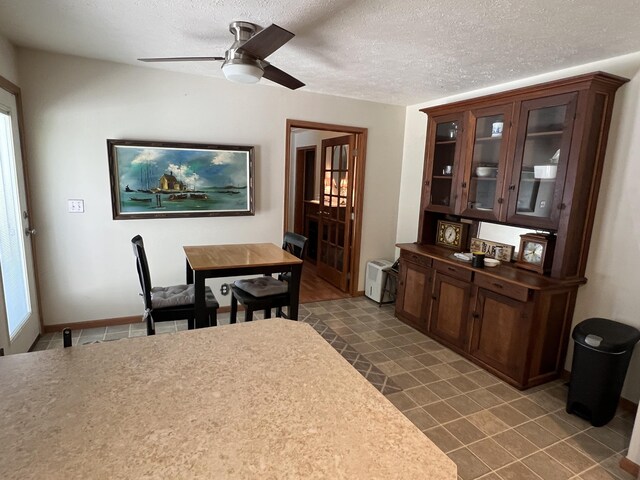 260 Treml, Michigan, MI 49411 - dining area featuring a ceiling fan and a textured ceiling